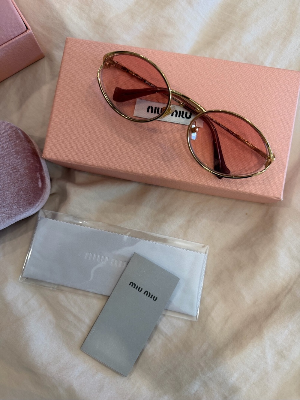 Miu Miu Gold Frame Sunglasses with Pink Tinted Lenses